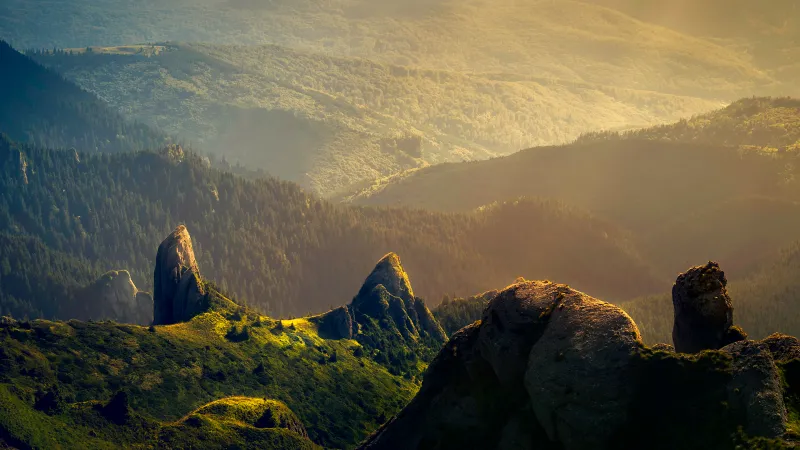 Rock spires, Forested mountains, Golden light, 4K wallpaper