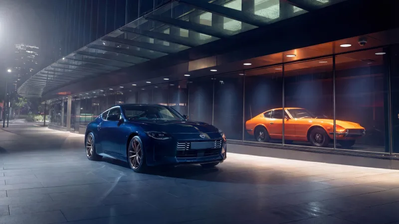Nissan Z Heritage Edition wallpaper, Blue Z and orange 240Z, Showroom at night, 2026, 5K