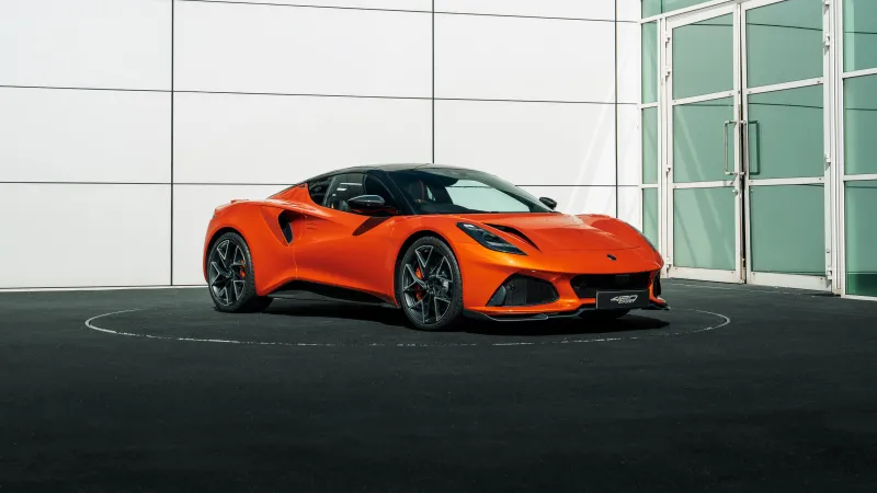 Lotus Emira 420 Sport wallpaper, Orange sports car, Showroom, 8K