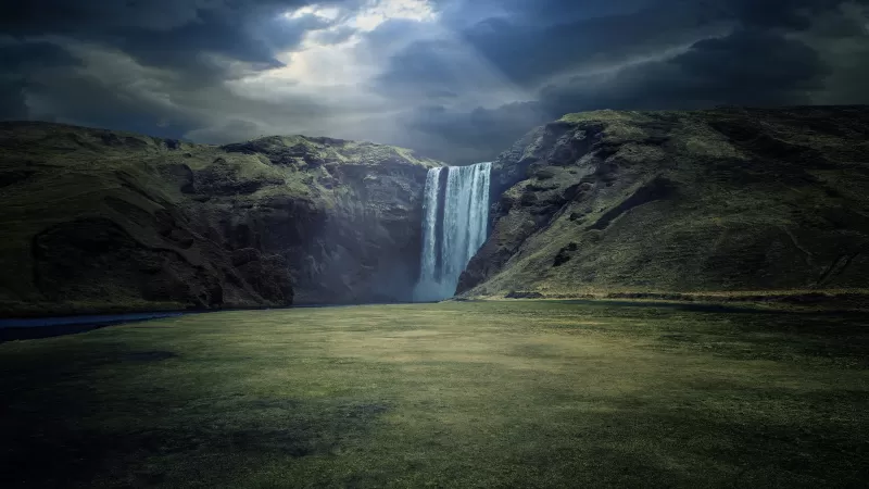 Skógafoss, Waterfalls, Iceland, Cliffs, Sun rays, Skógá River, Dark clouds, Landscape, Scenery, Green Grass