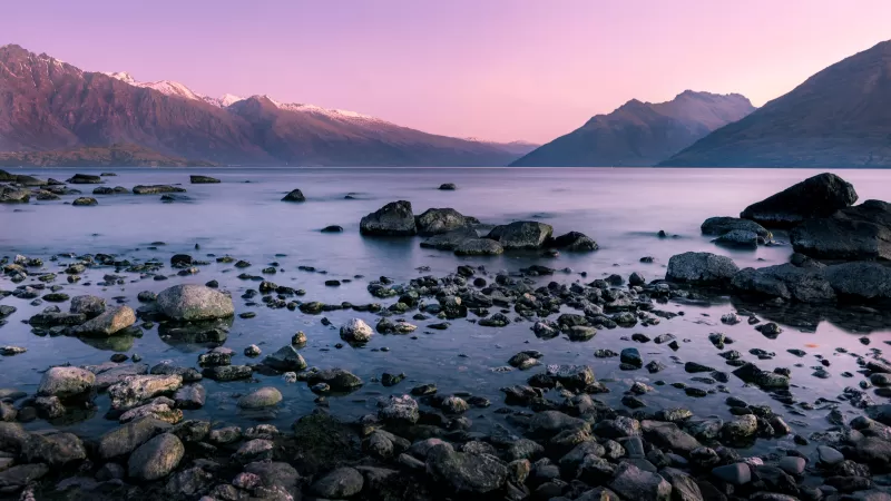 Rocky lakeshore, Pink dusk sky, Mountain range, 5K wallpaper