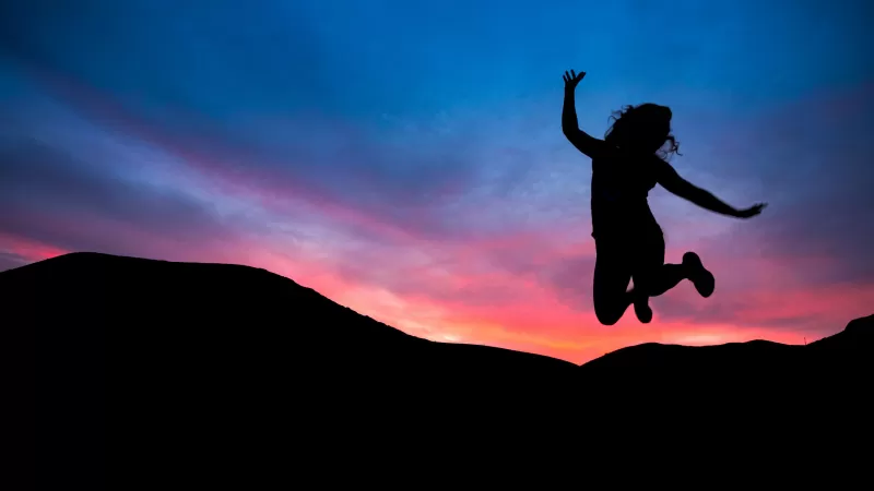 Jumping girl silhouette wallpaper, Sunset joy, Pink sky