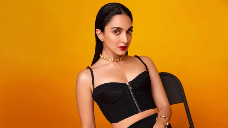 Kiara Advani 4K wallpaper, Black dress, Orange background, Indian actress