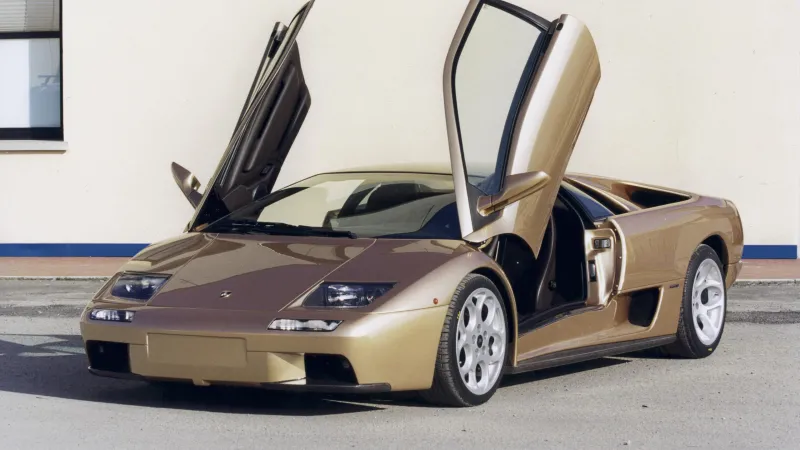 Lamborghini Diablo wallpaper, Gold supercar, Scissor doors, Exotic car, Automotive.