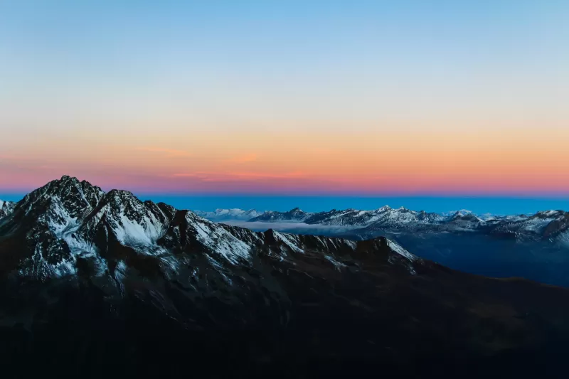 Snowy peak at sunrise, Alpine ridge, Orange horizon, 4K wallpaper