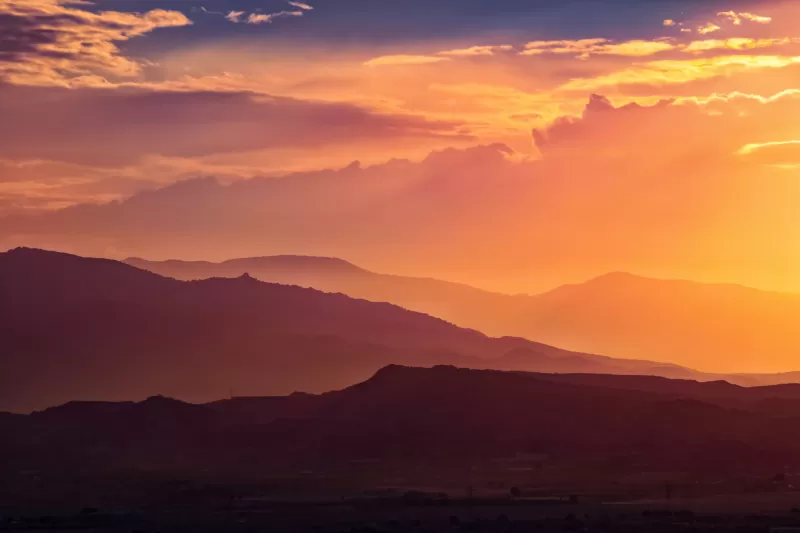 Orange sunset wallpaper, Layered mountains, Golden clouds